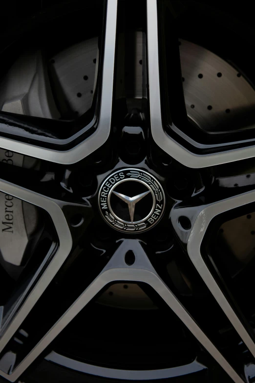 a close up of a wheel on a car, black and silver, gun metal grey, mercedes, black on black