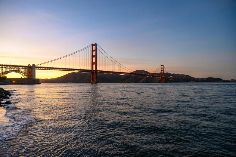 a view of the golden gate bridge at sunset, pexels contest winner, renaissance, a photo of a lake on a sunny day, promo image, metallic bridge, f / 1 1. 0