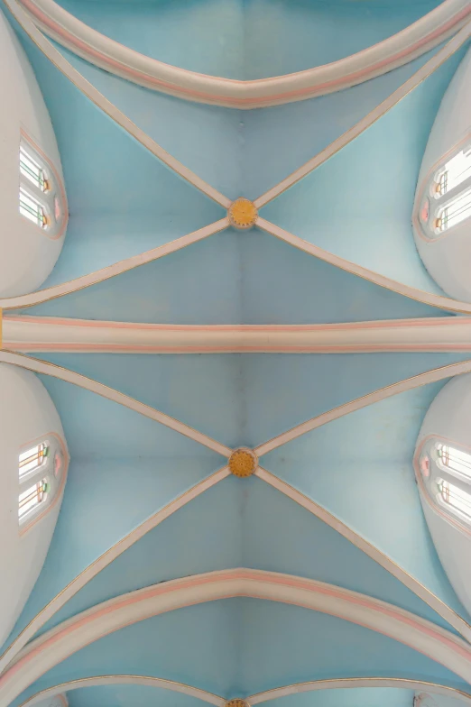 the ceiling of a church with a clock on it, inspired by Lawren Harris, unsplash, conceptual art, pastel blue, ignant, buttresses, demur