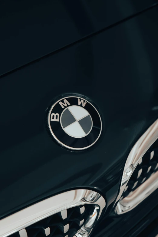 a close up of a bmw emblem on a car, by Adam Marczyński, pexels contest winner, synthetism, plain background, 15081959 21121991 01012000 4k