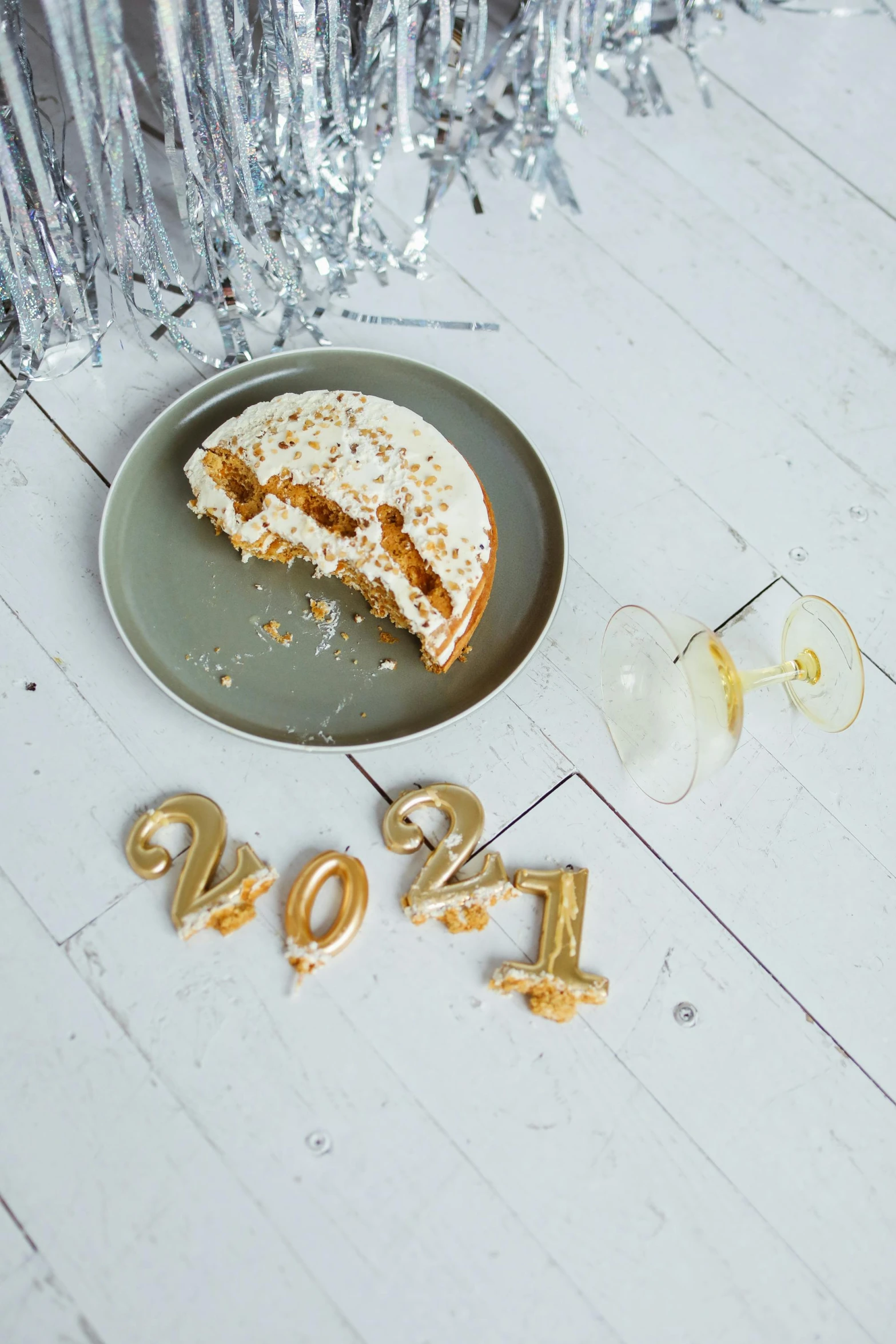 a plate that has a piece of cake on it, trending on pexels, happening, new years eve, dough sculpture, blond, 2021