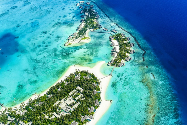 an island in the middle of the ocean, by Julia Pishtar, pexels contest winner, hurufiyya, resort, helicopter view, slide show, thumbnail