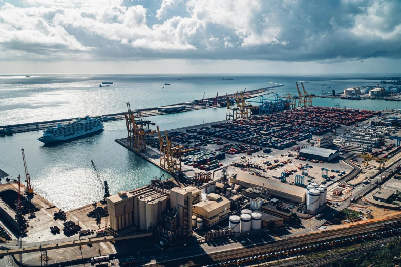 a harbor filled with lots of ships under a cloudy sky, a tilt shift photo, pexels contest winner, hurufiyya, shipping containers, avatar image