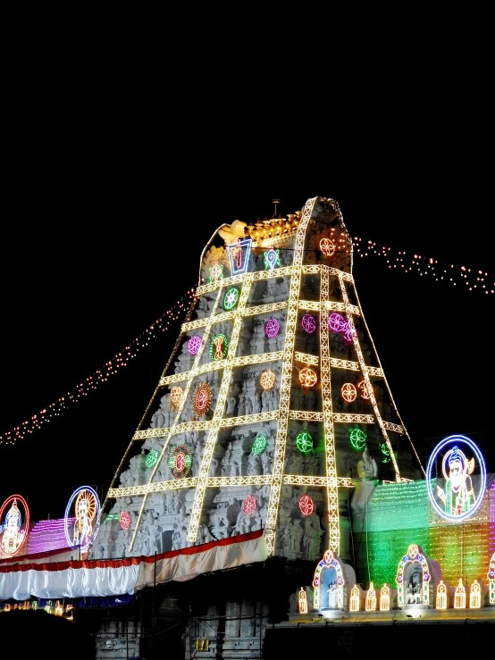 a very tall building with a lot of lights on it, samikshavad, with kerala motifs, thumbnail, pyramid, slide show