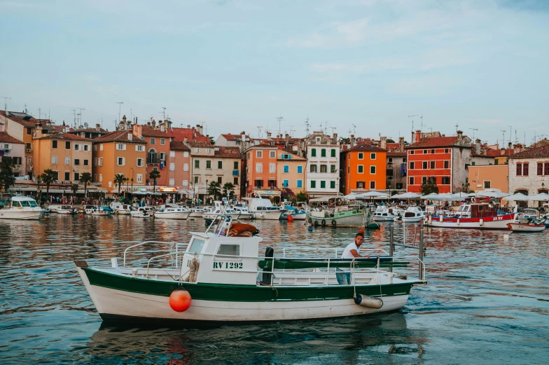 a group of boats floating on top of a body of water, by Emma Andijewska, pexels contest winner, renaissance, croatian coastline, wes anderson style, square, profile image