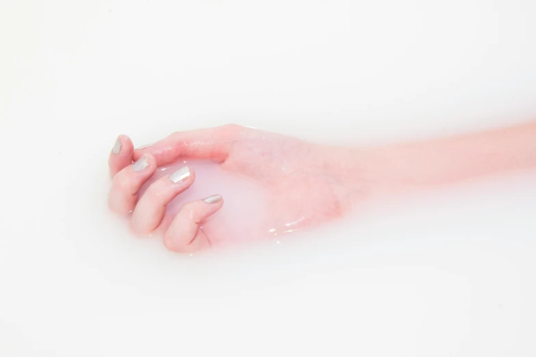 a close up of a person's hand in a bathtub, inspired by Elsa Bleda, unsplash, process art, patricia piccinini, translucent white skin, ilustration, inflatable