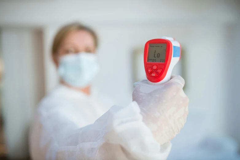 a person in a lab coat holding a thermometer, red laser scanner, high quality photo, fan favorite, hazmat suits