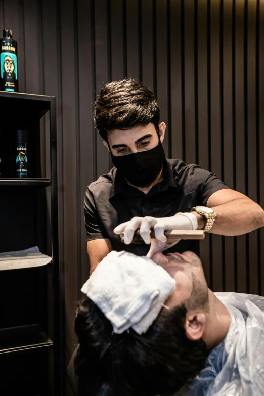 a man getting a haircut at a barber shop, mask off, sharped nose, asher duran, balaclava