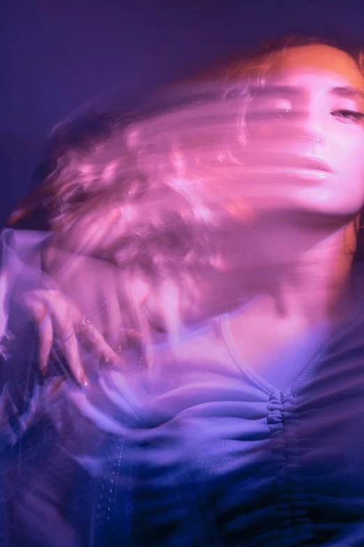 a woman with her hair blowing in the wind, inspired by Elsa Bleda, holography, purple volumetric lighting, photograph taken in 2 0 2 0, petra collins and mc. escher, translucent body