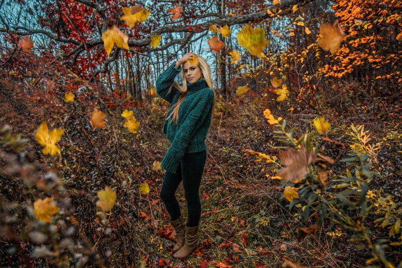 a woman standing in the middle of a forest surrounded by leaves, by Emma Andijewska, unsplash contest winner, seasons!! : 🌸 ☀ 🍂 ❄, vermont fall colors, 2 4 year old female model, 1024x1024