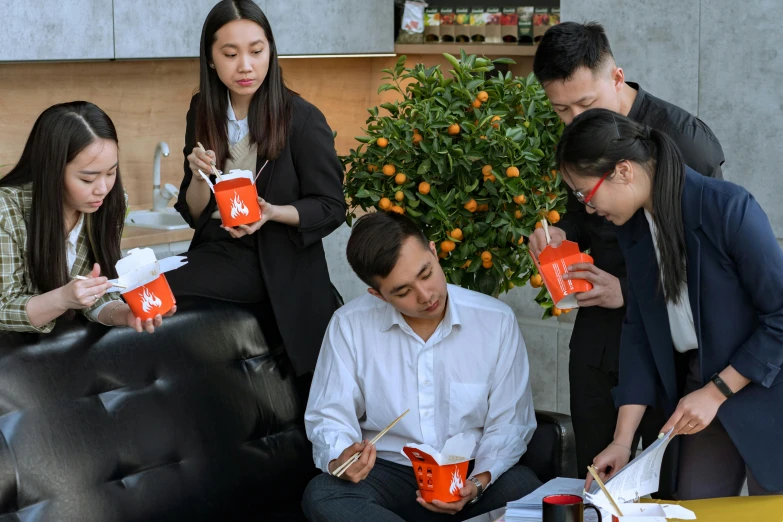 a group of people sitting on top of a black couch, inspired by Fei Danxu, pexels contest winner, gutai group, holding hot sauce, eating noodles, office, avatar image