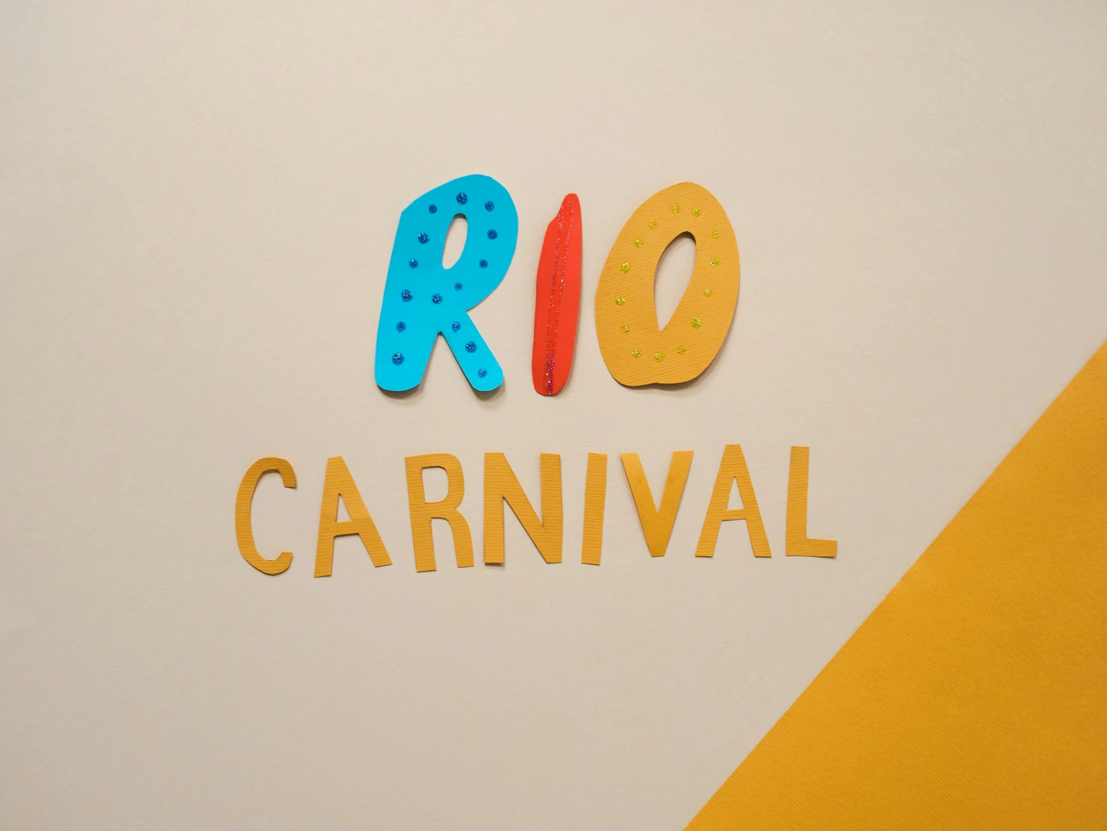 a close up of a sign that says rio carnival, an album cover, by Rachel Reckitt, plain studio background, tearaway, kidmo, casual