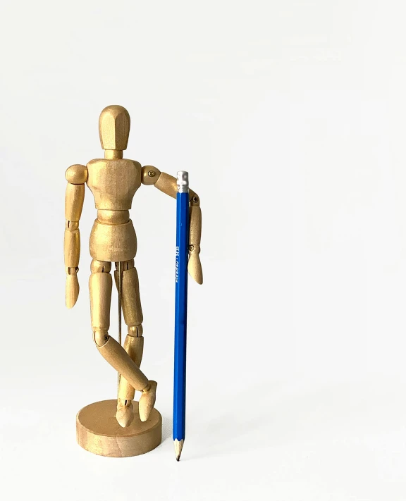 a wooden mannequin holding a blue pencil, inspired by Sarah Lucas, new sculpture, detailed product image, sassy pose, ilustration, product introduction photo