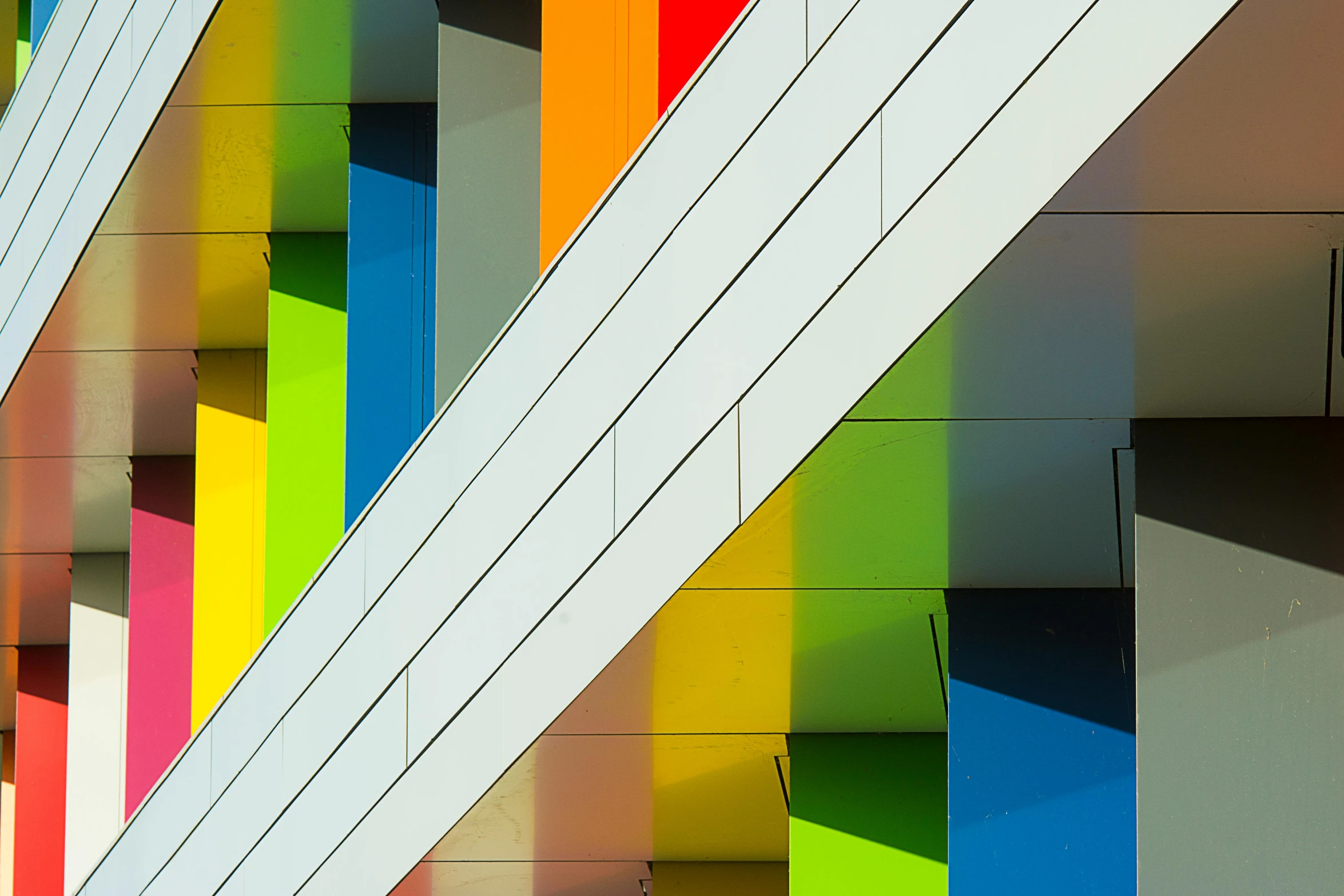 a multicolored building on a sunny day, a photo, bauhaus, color ( sony a 7 r iv, square lines, rainbow colors, closeup