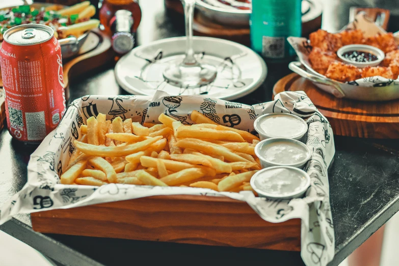 a tray of french fries sitting on top of a table, a still life, inspired by Pia Fries, unsplash, fish in the background, restaurant menu photo, 🦩🪐🐞👩🏻🦳, chilean