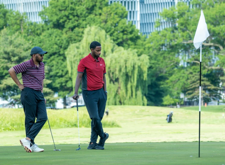 two men standing next to each other on a golf course, a photo, happening, jemal shabazz, avatar image