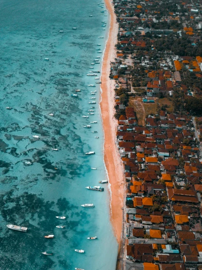 a large body of water next to a beach, by Daniel Lieske, pexels contest winner, happening, fishing village, hyperdetailed!, orange and blue colors, flatlay