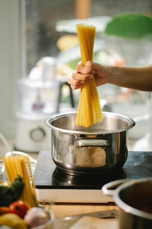 a person that is cooking some food on a stove, pasta, high quality product image”, perfectly poised, multiple stories