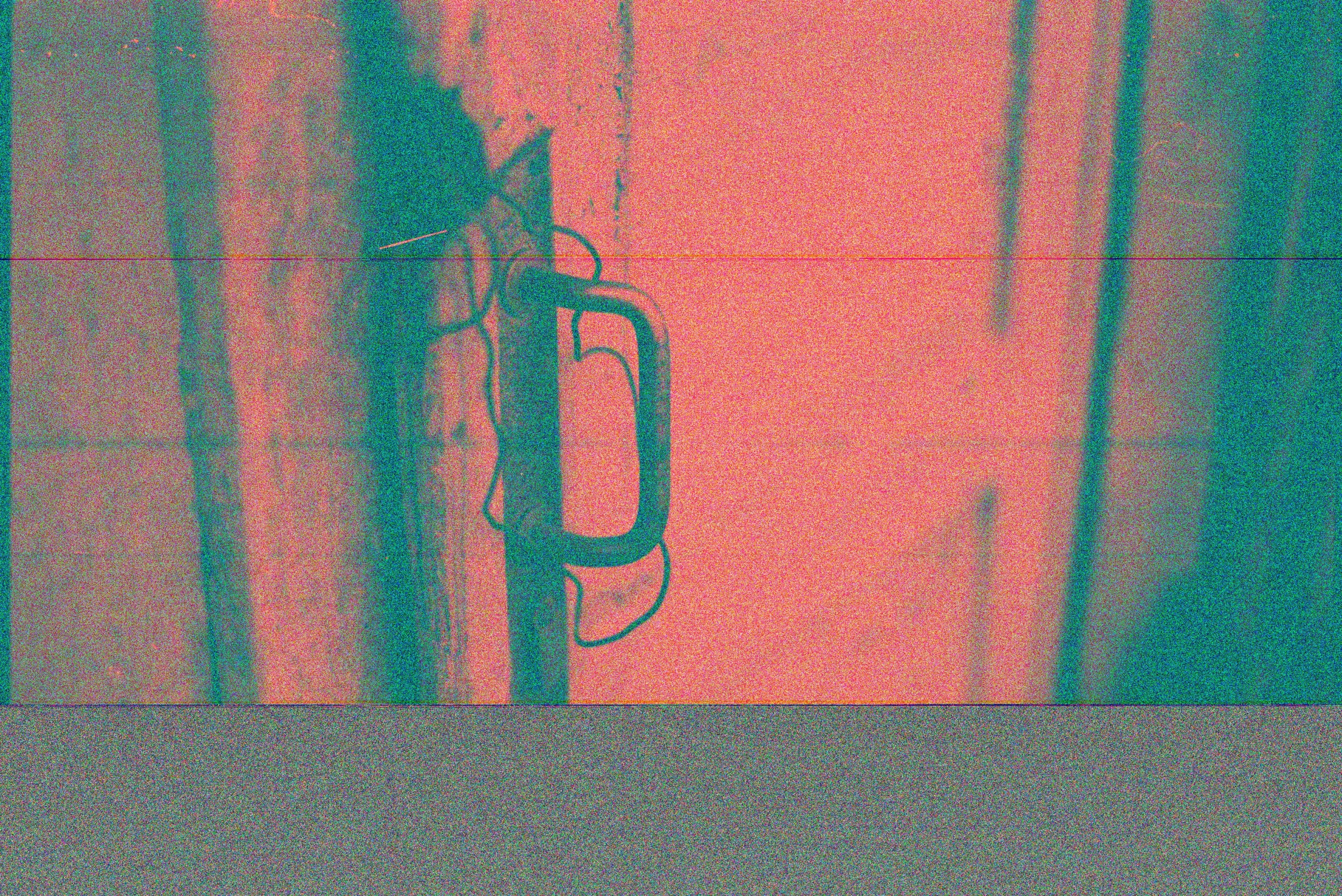 a close up of a cell phone on a wall, an album cover, flickr, conceptual art, red and cyan ink, greenish expired film, psychedelic photoluminescent, antenna