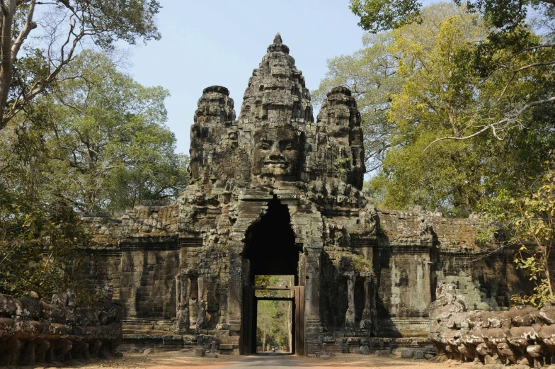 a large stone structure surrounded by trees, a portrait, hurufiyya, angkor thon, avatar image, huge gate, square