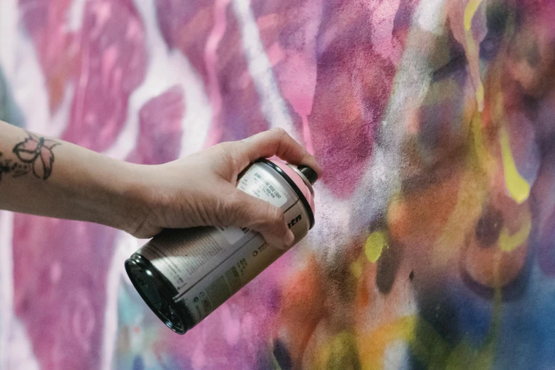 a person spraying graffiti on a wall with a spray can, a hyperrealistic painting, inspired by Tomokazu Matsuyama, unsplash, process art, close up. macro. hyper realistic, “hyper realistic, hyperrealistic, hyper realistic