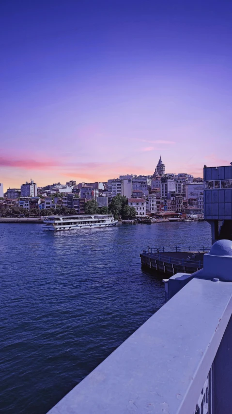 a large body of water next to a city, by Niyazi Selimoglu, pexels contest winner, art nouveau, dusk light, slide show, olafur eliasson, port