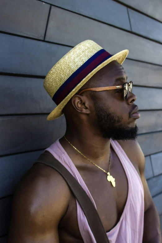 a man in a straw hat leaning against a wall, an album cover, inspired by Theo Constanté, trending on pexels, wearing gold glasses, profile image, roygbiv, kevin hart