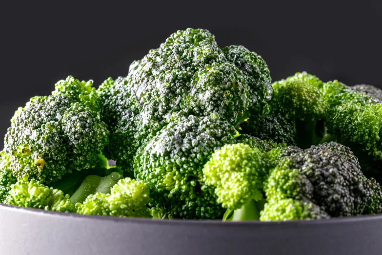 a close up of a bowl of broccoli, a digital rendering, pexels, shot on hasselblad, grey vegetables, detailed product image, stacked image