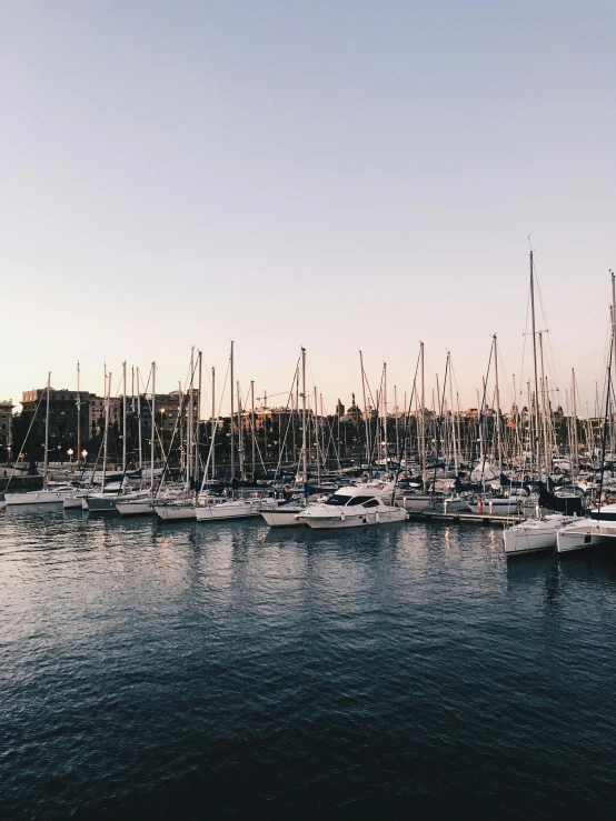 a number of boats in a body of water, a photo, pexels contest winner, in barcelona, sydney mortimer laurence, seen from outside, late afternoon