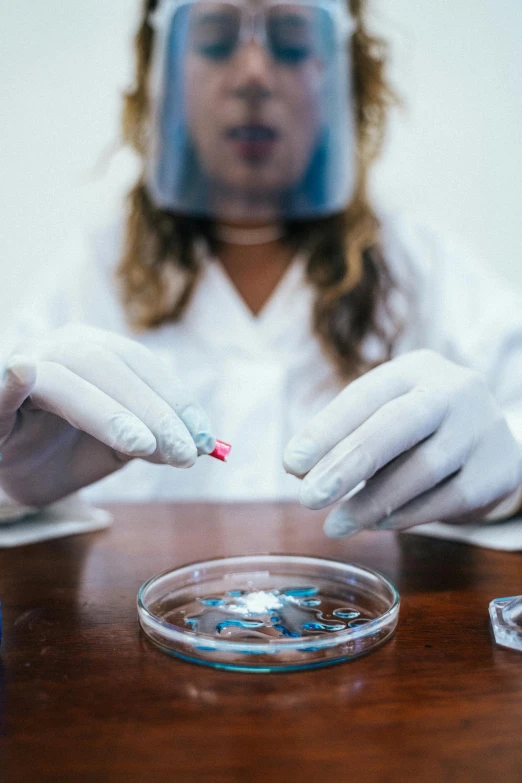 a close up of a person in a lab coat, by Adam Marczyński, pexels contest winner, bismuth cups, contracept, working in her science lab, “diamonds