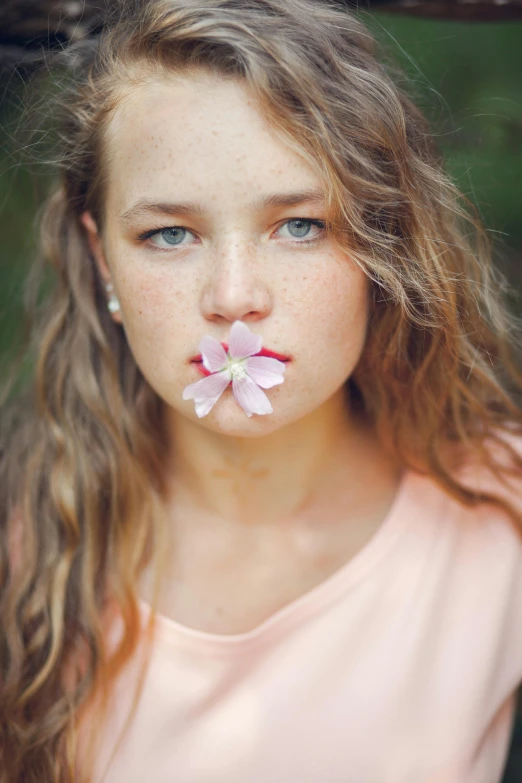 a girl with a flower in her mouth, by Thomas Bock, unsplash, young teen, manuka, mini model, plumeria