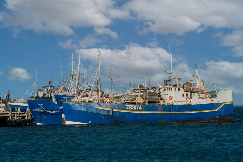 a couple of boats that are in the water, by Sven Erixson, pexels contest winner, hurufiyya, big graphic seiner ship, blue, fish market, straya