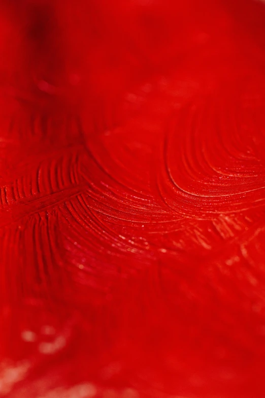 a close up of a red table cloth, inspired by Lucio Fontana, lyrical abstraction, embossed paint, swirl, soft light, photographed for reuters