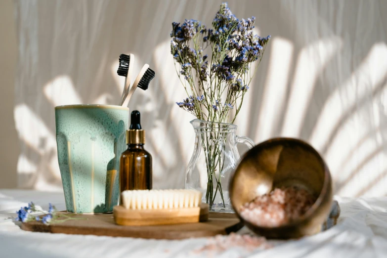 a bunch of items that are sitting on a table, a still life, trending on pexels, natural skin, dry brush, bath like style, brown