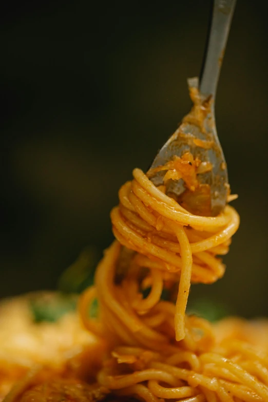 a plate of spaghetti with a fork sticking out of it, a picture, by Matt Cavotta, pexels, orange details, dynamic closeup, shot from cinematic, slide show