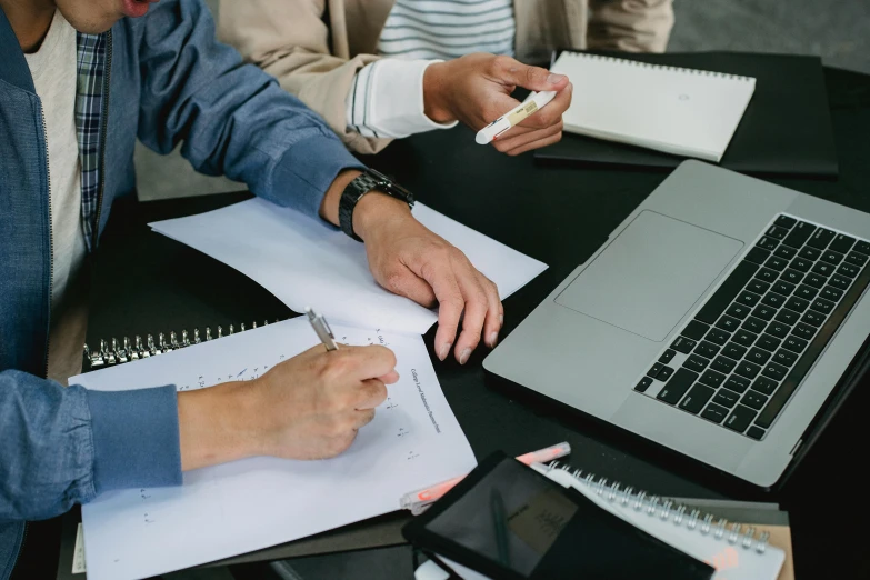 a couple of people sitting at a table with laptops, pexels contest winner, analytical art, pen and paper, business meeting, background image