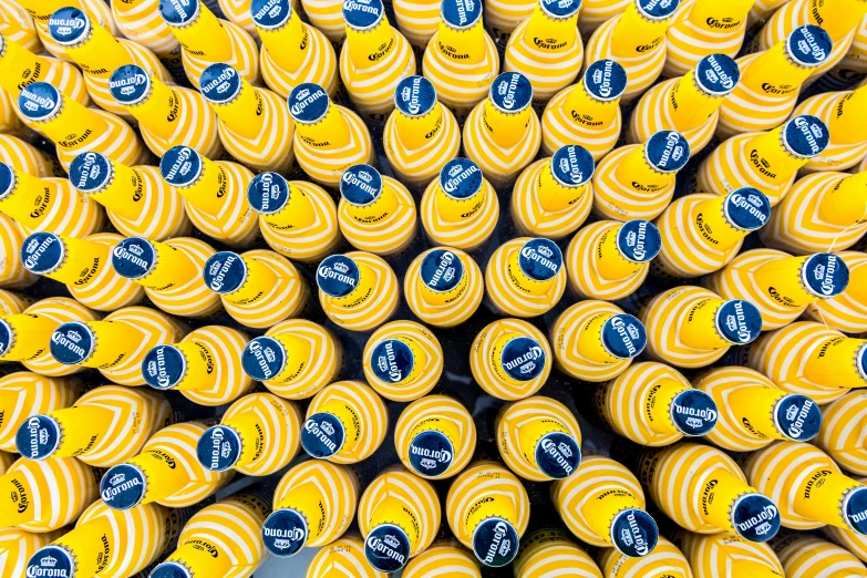a bunch of yellow tennis balls stacked on top of each other, by Matthias Stom, process art, blue and white and gold, são paulo, yellow cap, promotional