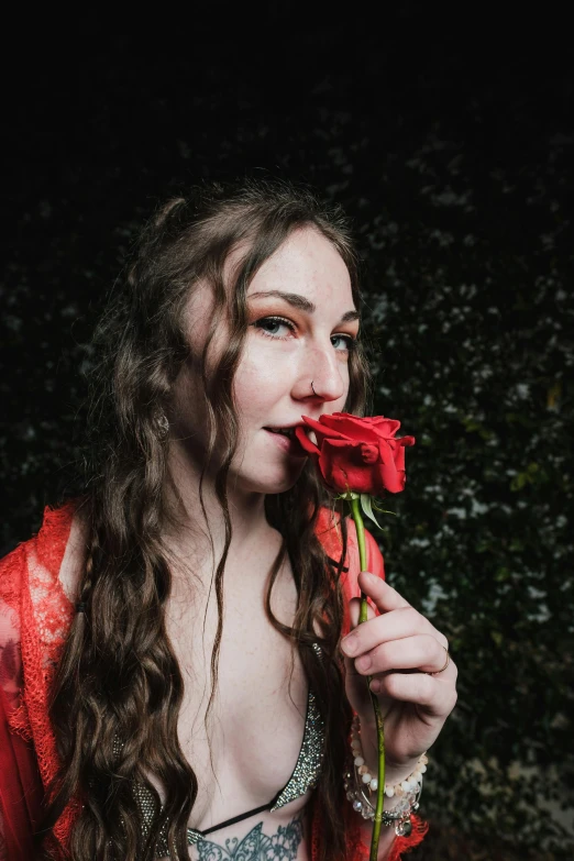 a woman in a red dress holding a rose in her mouth, an album cover, inspired by Elsa Bleda, pexels contest winner, renaissance, freckled pale skin, headshot profile picture, teenage girl, 1614572159