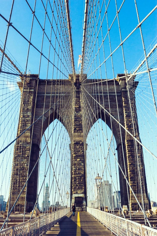 the brooklyn bridge in new york city, inspired by Christo, unsplash, renaissance, zoomed in, hanging, dramatic ”