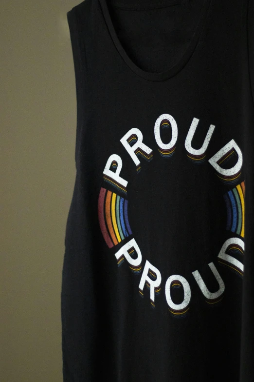 a black tank top with the word proud on it, photo still of, rainbow, photograph credit: ap, katey truhn