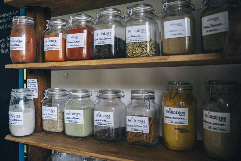 a shelf filled with lots of different types of spices, a portrait, pexels, large jars on shelves, exterior shot, hazy, thumbnail