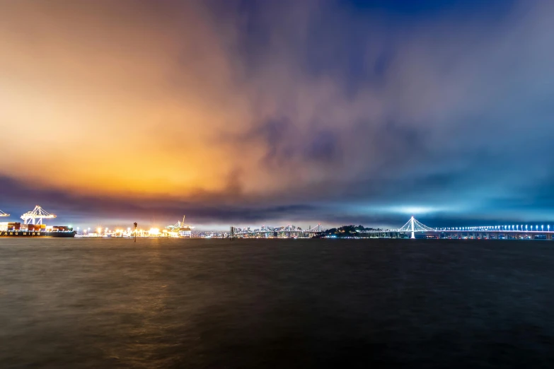 a large boat floating on top of a body of water, by Matt Cavotta, unsplash contest winner, city sunset mist neon lights, bay area, panorama, overcast