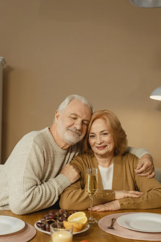 a man and a woman sitting at a table, wholesome, brown, old male, sparkling
