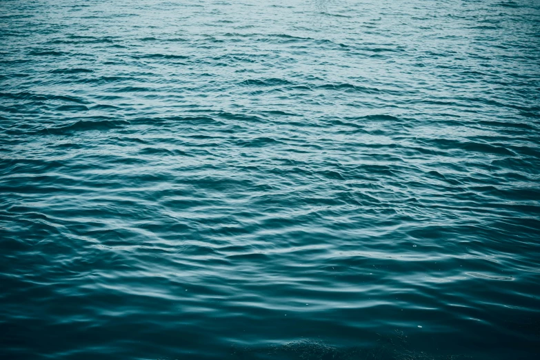 a large body of water with a boat in the distance, an album cover, inspired by Elsa Bleda, unsplash, hurufiyya, ripples, teal, wallpapers, alessio albi