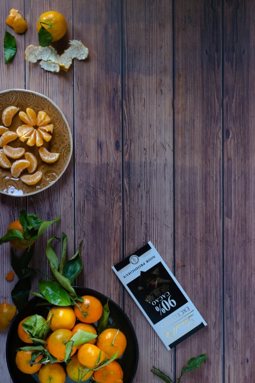 a bowl of oranges sitting on top of a wooden table, chocolate candy bar packaging, te pae, 360 degree view, old fashioned