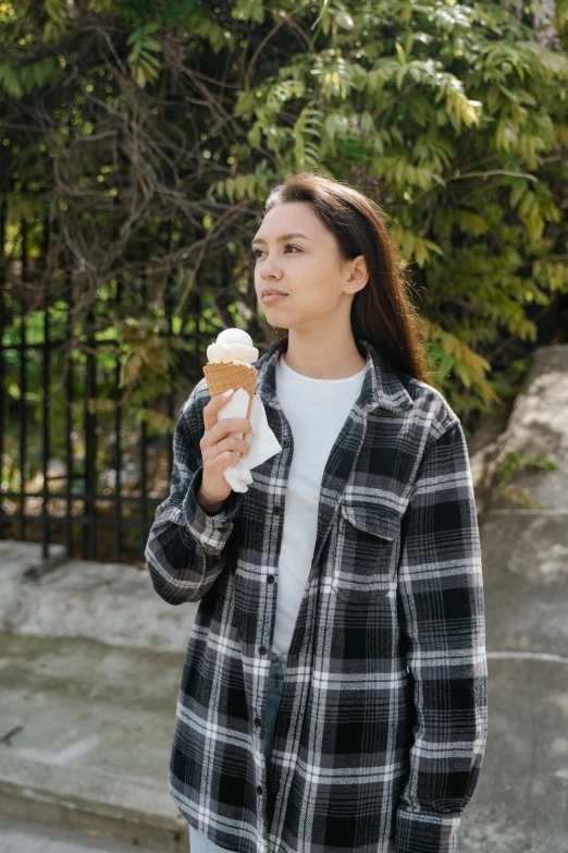 a woman holding an ice cream cone in her hand, trending on unsplash, renaissance, wearing a flannel shirt, concerned, 15081959 21121991 01012000 4k, al fresco