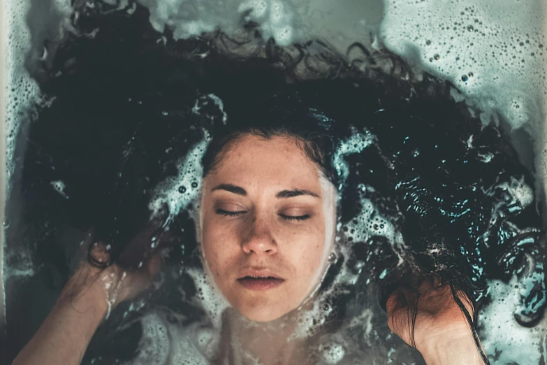 a woman washing her hair in a bathtub, inspired by Elsa Bleda, trending on pexels, renaissance, portrait of a woman underwater, made of liquid, bedhead, float