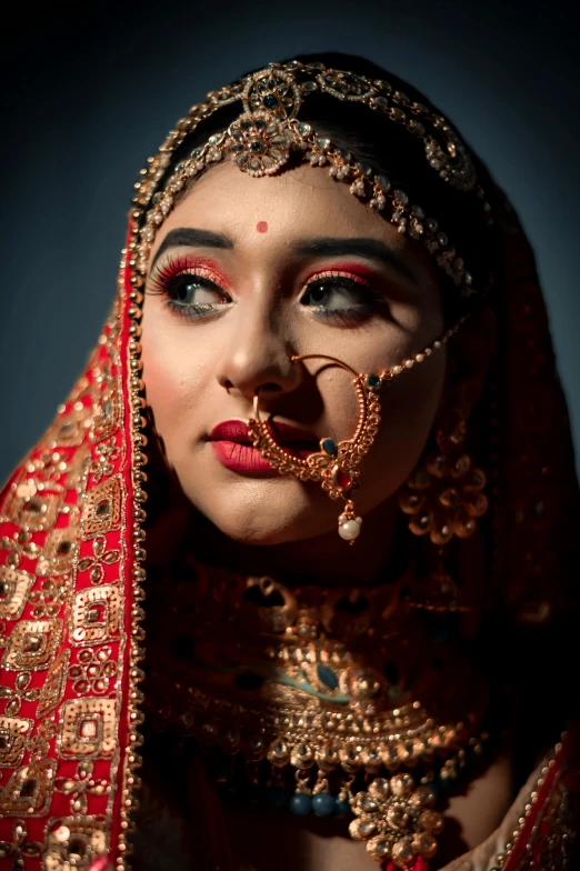 a woman in a red and gold outfit, an album cover, by Sudip Roy, pexels contest winner, featured face details, jewelry, eyes, square