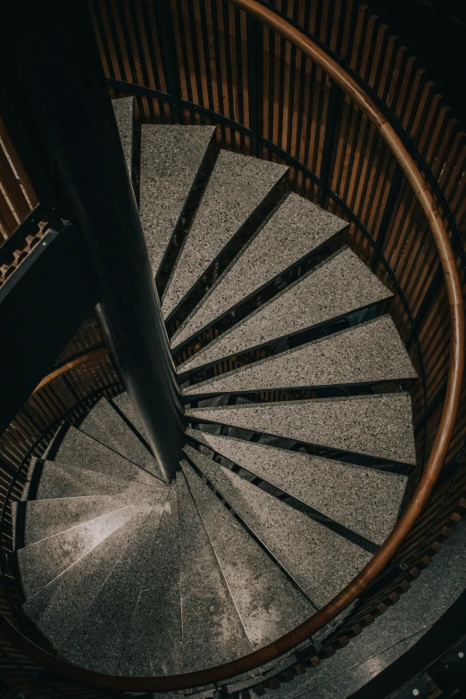 a spiral staircase leading to the top of a building, by Daniel Seghers, pexels contest winner, isometric staircase, low light, slate, brown