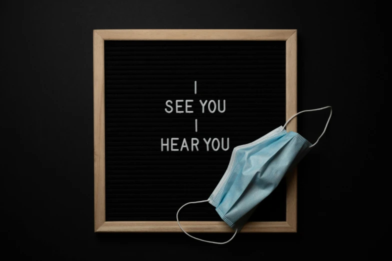 a sign that says, i see you hear you, by Sebastian Vrancx, trending on pexels, medical mask, lie detector test, black, bl